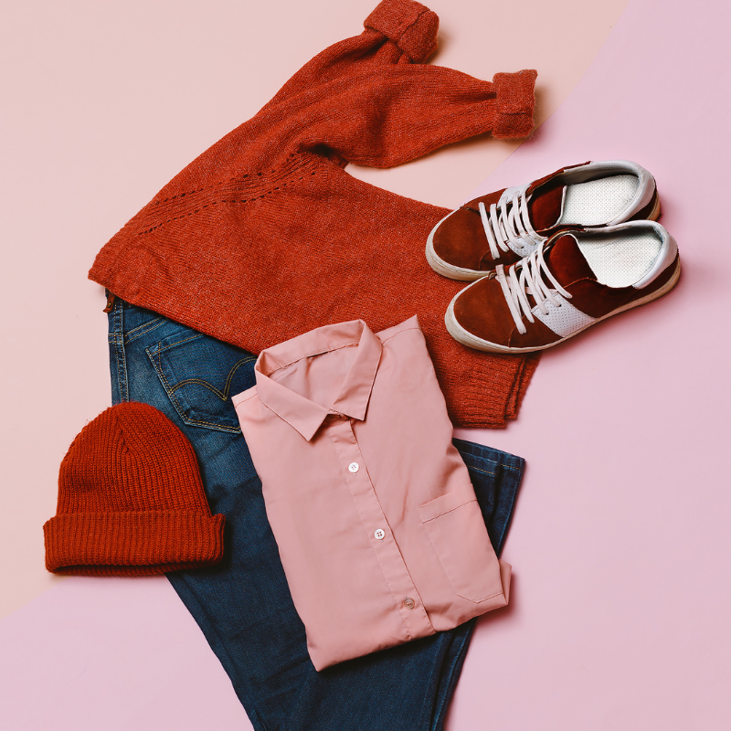 fashion grid 6 red and pink clothes and blue jeans laid out on a pink surface