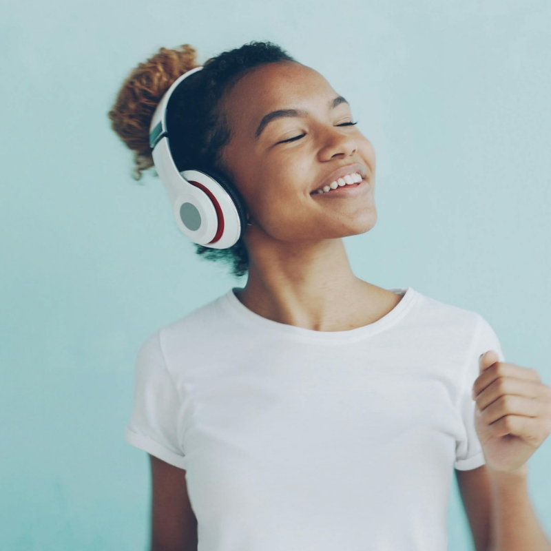 electronics grid 4 girl listening to music through headphones