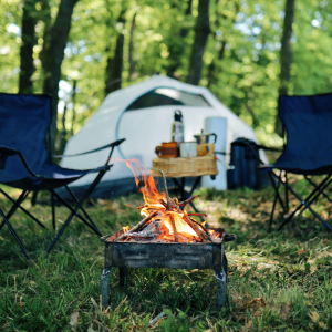 camping chairs, tent and fire