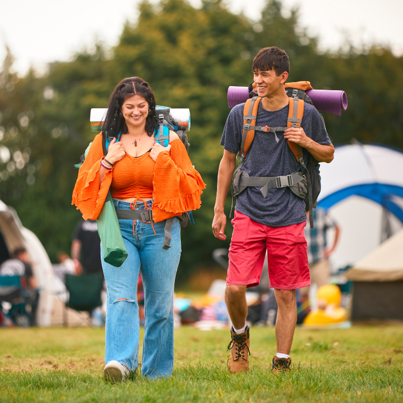 outdoor grid 5 two people walking to a festival